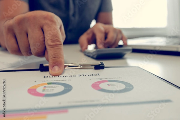 Fototapeta Businessman working with diagrams. Close up of hands and documents. Online education. Concept of office routine.