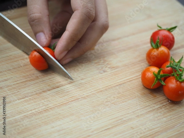 Obraz Ripe tomatoes on wooden board background, Fresh cherry tomatoes on wooden background, tomatoes on wooden background, Selective focus.
