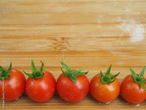 Obraz Ripe tomatoes on wooden board background, Fresh cherry tomatoes on wooden background, tomatoes on wooden background, Selective focus.