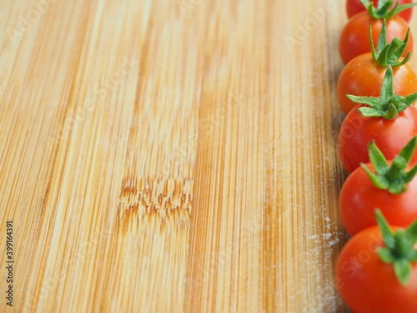 Obraz Ripe tomatoes on wooden board background, Fresh cherry tomatoes on wooden background, tomatoes on wooden background, Selective focus.