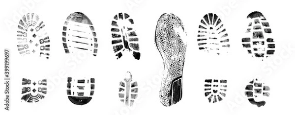 Fototapeta Muddy bootprints. Isolated on white background. Close up