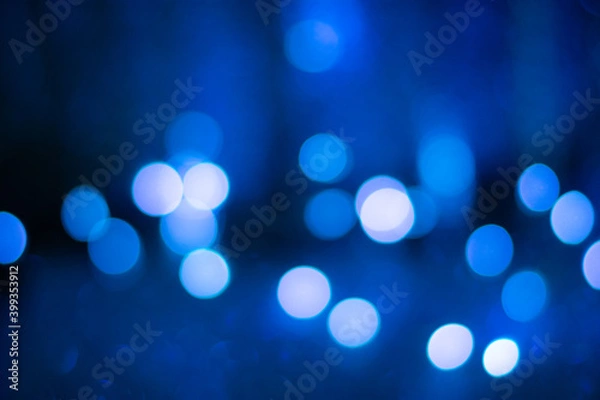Obraz Blue bokeh, blurred background, christmas background. Neon color.
