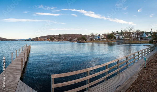 Fototapeta Late afternoon view of Lake Winnipesaukee and Meredith, New Hampshire, on a clear, crisp blue sky day.