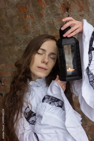 Obraz Russia, Moscow - 22/11/2020: Photo session in the style of a girl student of the 19th century. Beautiful tender girl.