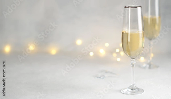 Fototapeta Color of the year 2021: grey and yellow. Two glasses of champagne. 