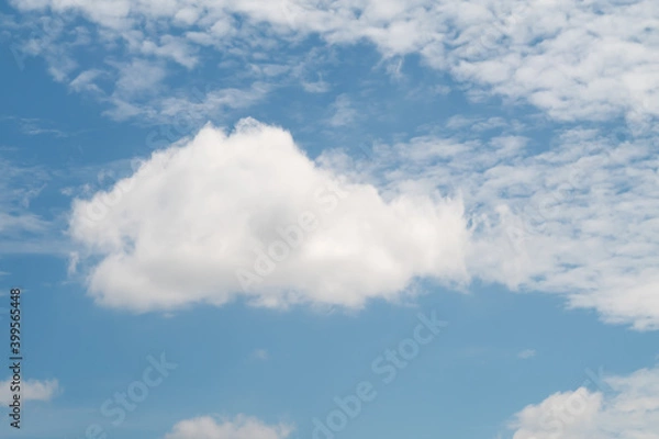 Fototapeta Large Cumulus cloud and Altocumulus clouds against blue sky in sunny day.