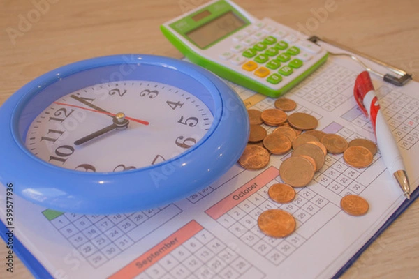 Fototapeta finance business calculation. coin stack with a clock background