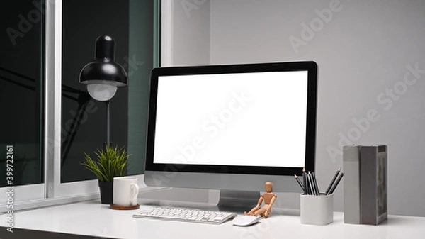 Obraz Creative designer workplace with computer and equipment on white table.