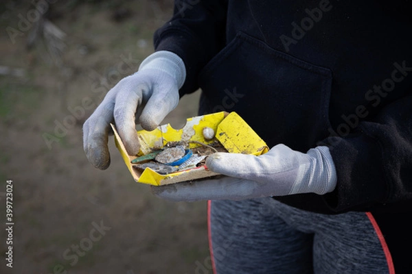 Obraz hand holding a plastic
