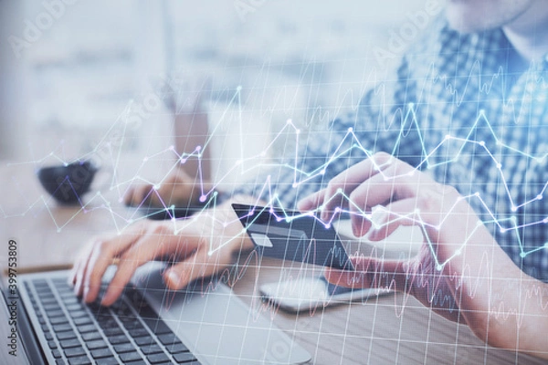 Fototapeta Double exposure of man hands holding a credit card and Forex graph drawing. Stock trading and digital fintech in Internet E-commerce concept.