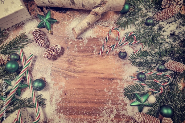 Fototapeta Christmas wooden background with snow fir tree. View with copy space