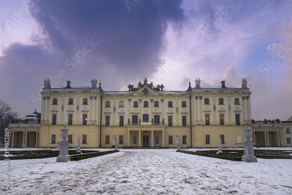 Fototapeta View of the building against the colorful sky in winter scenery.