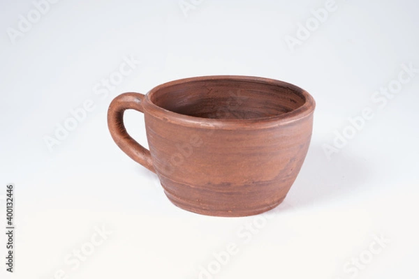 Fototapeta Pottery Craft, ceramic product with your own hands, made on a Potter's wheel, isolated on a white background