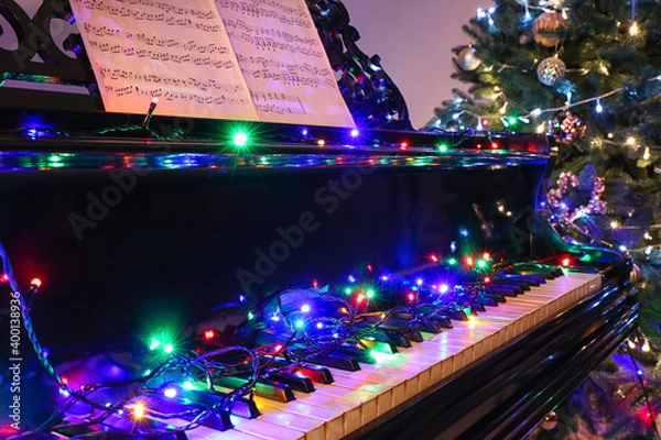 Fototapeta Grand piano decorated for Christmas in room
