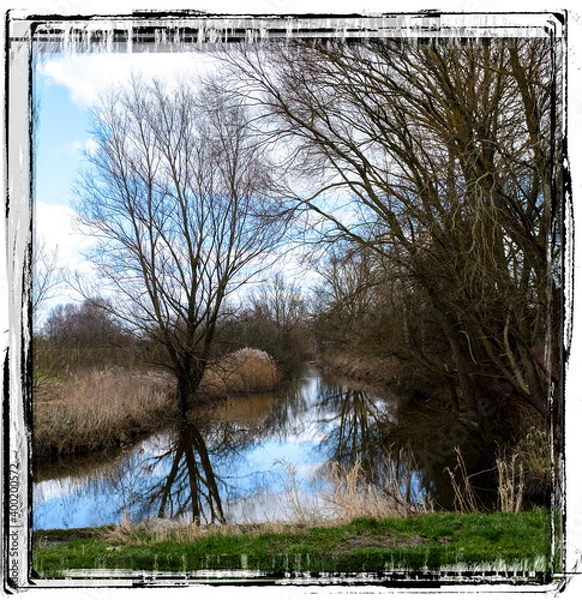 Fototapeta slowly the river flows through the landscape