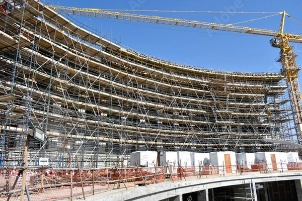 Fototapeta scaffolding Platform for a canopy works. a new civil construction site Building in Oman. Oman city. 