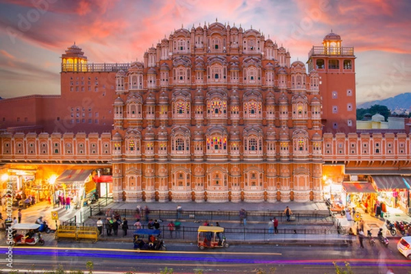 Obraz Stunning view of the Hawa Mahal at sunset with blurred people walking during the Covid-19 outbreak.The Hawa Mahal is a palace in Jaipur, India.
