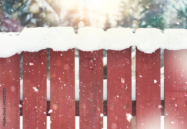 Obraz Wooden red fence in the snow. Winter background