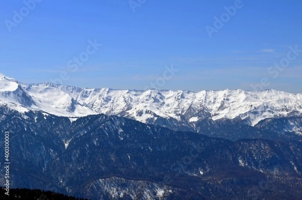 Fototapeta Winter landscape in the mountains with peaks and gorges, freestyle trails.