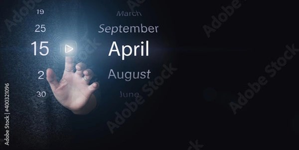 Fototapeta April 15th. Day 15 of month, Calendar date. Hand click luminous icon PLAY and DATE on dark blue background. Spring month, day of the year concept.