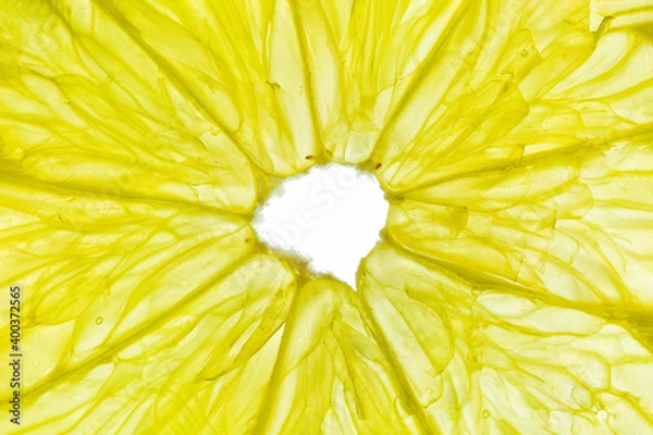 Fototapeta Close-up of a yellow lemon slice isolated on a white background.