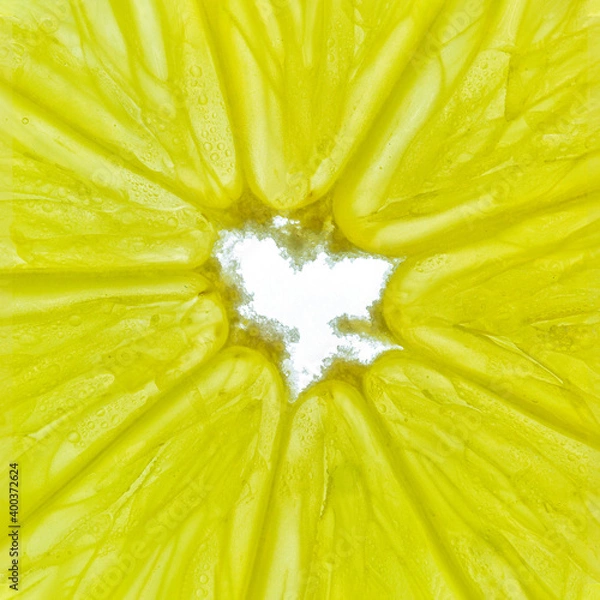 Fototapeta Close-up of a yellow lemon slice isolated on a white background.