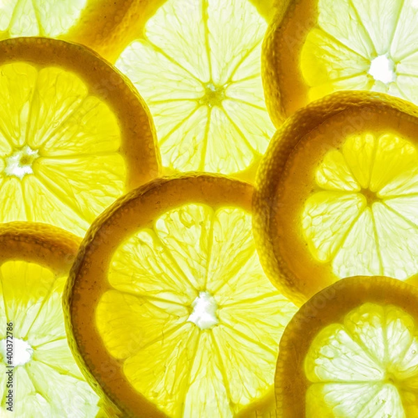 Fototapeta Yellow lemon slices isolated on a white background.