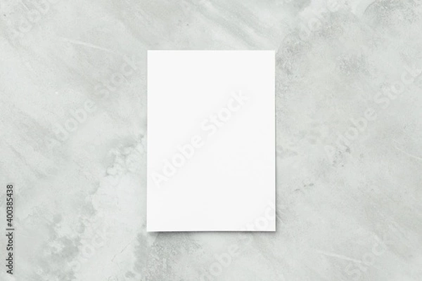 Fototapeta Blank white A4 paper sheet on concrete floor