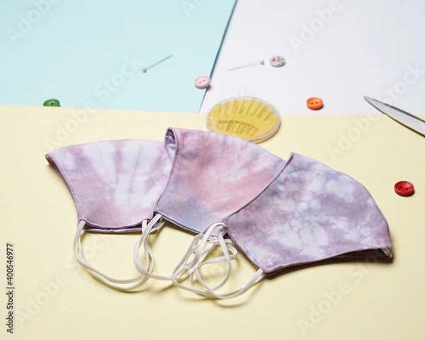 Fototapeta DIY project for handicraft health mask, made of cotton cloth with tie dye. Medical masks made of cloth and sewing kits. Tie-dye mask with an attractive color. The pink tie-dye mask is ready to use.