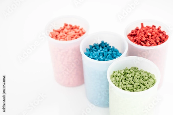 Fototapeta Plastic granules close up for holding,Colorful Plastic granules with white background.