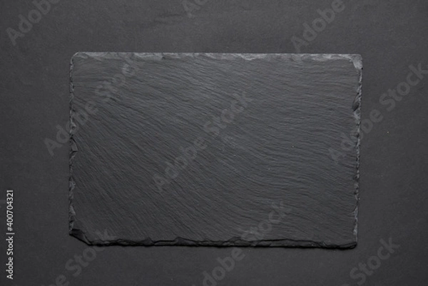 Fototapeta Black textured sushi slate board background with copyspace. Place for sushi, Japanese cuisine concept.