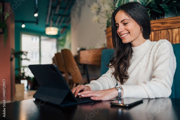 Obraz Doing networking, using digital tablet.