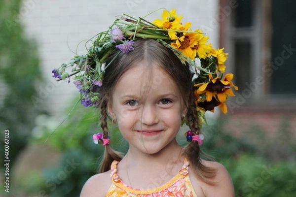 Obraz Smiling girl with wreath of flowers on her head