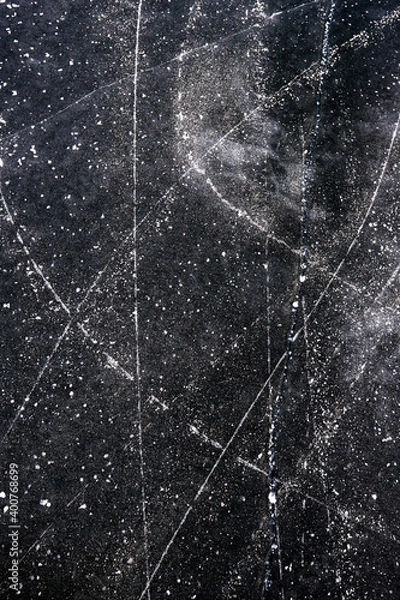 Fototapeta background of the surface of patterned black ice of a frozen lake