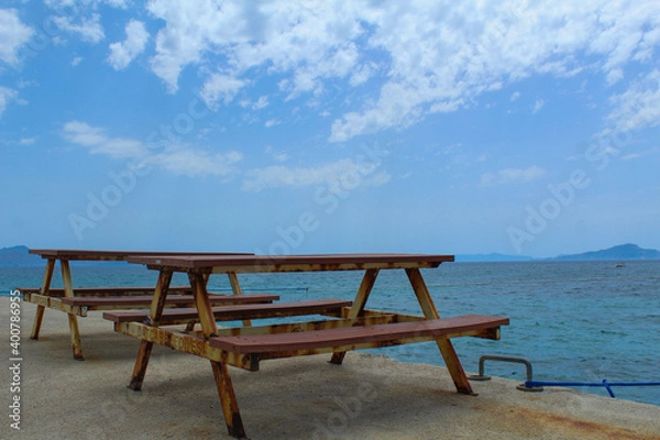 Obraz Picnic table standing near to the sea, no people, selective focus