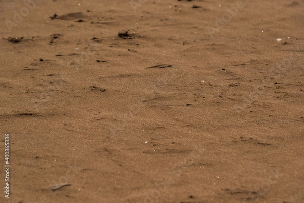 Fototapeta Full screen sand with selective focus on the center of the image
