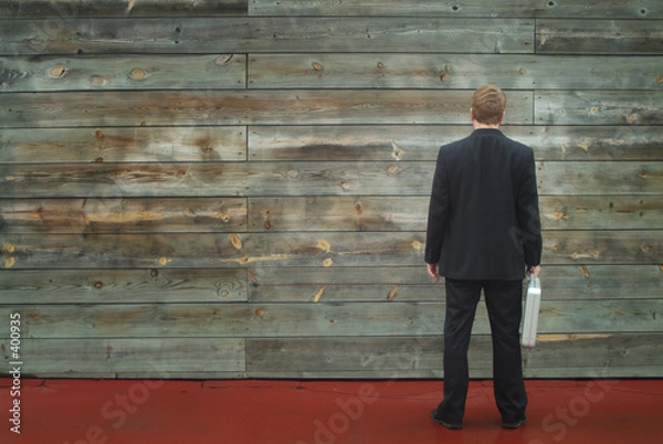 Obraz business man facing a wall