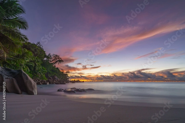 Fototapeta sunset at tropical beach anse georgette on praslin, seychelles