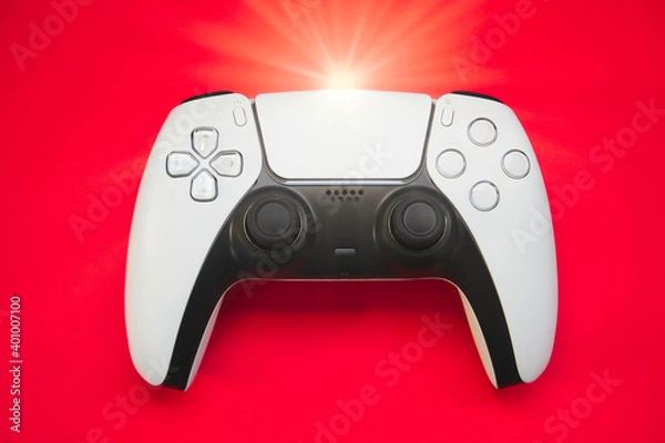 Fototapeta Video games white gaming controller joystick isolated on red color sky background, top view with copy space