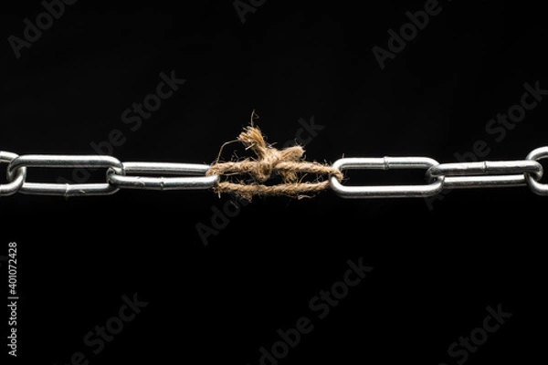 Fototapeta The chain is tied together with a rope. Weak link in the chain.