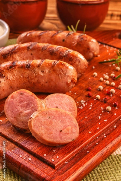 Fototapeta Brazilian pork sausage  BBQ - Churrasco de linguiça de suina close up