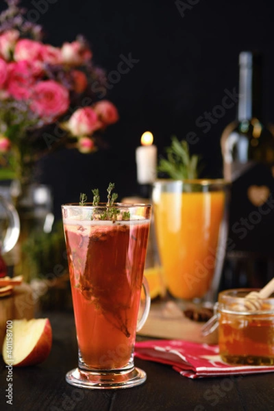 Fototapeta Composition with herbal and fruit hot alcohol drinks with ingredients on the table