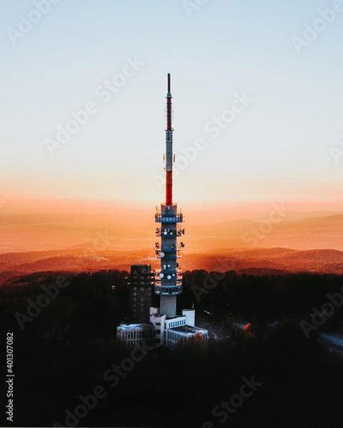 Fototapeta Aerial shot of Television Tower and Observation platform on top of famous Kekes Mountain during colorful sunset. Kekes Mountain,Hungary.