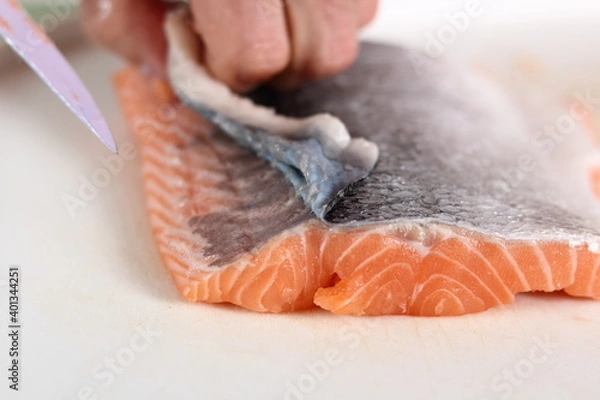 Fototapeta Removing Skin from Salmon Fillet. Making Salmon in Puff Pastry Series.