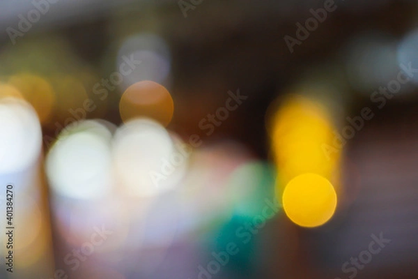 Fototapeta Colorful bokeh from the sunlight shining through the leaves.