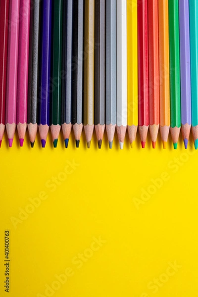 Fototapeta Color pencil, empty place for text or drawing on yellow background. creative art and education concept.
