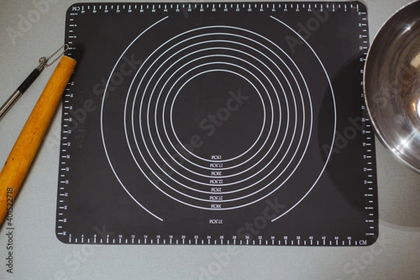 Obraz Silicone mesh for kneading the dough. Located on the kitchen table.
