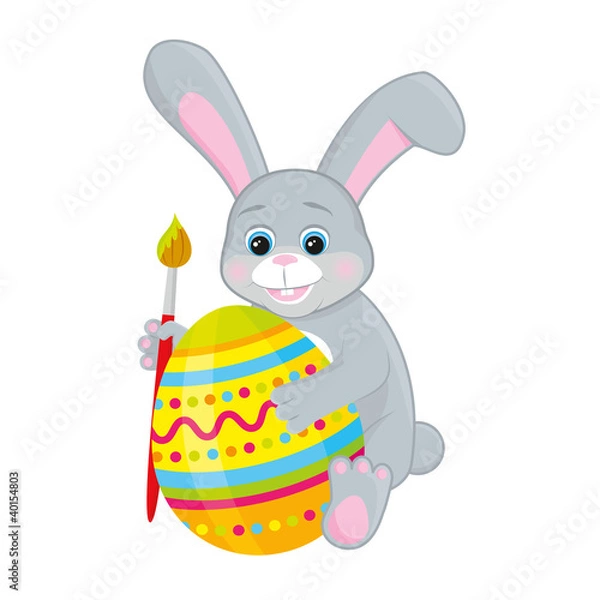 Obraz cute Easter Bunny draws on the egg