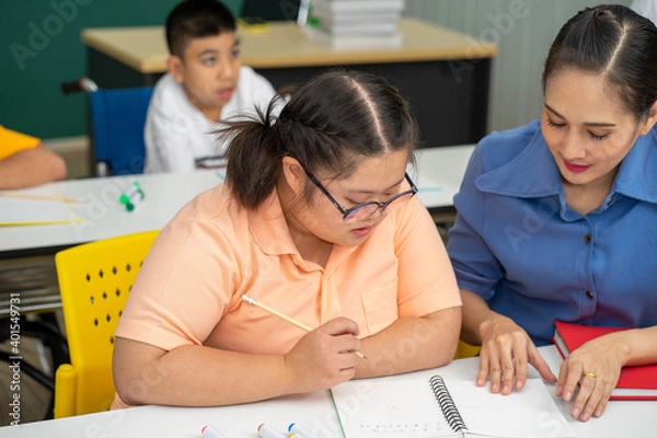 Fototapeta Asian Autism children with disability kid on wheelchair in special classroom with teacher. 