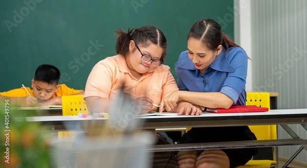 Obraz Asian Autism children with disability kid on wheelchair in special classroom with teacher. 